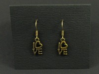 Boucles d'oreille couleur bronze avec l'inscription love