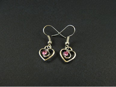 Boucles d'oreilles coeurs avec des strass roses