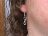Boucles d'oreilles fantaisie signe infini en métal argenté