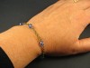 Bracelet fantaisie couleur bronze avec des perles de verre facettées bleues