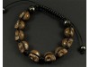 Bracelet composé de perles tête de mort couleur marron