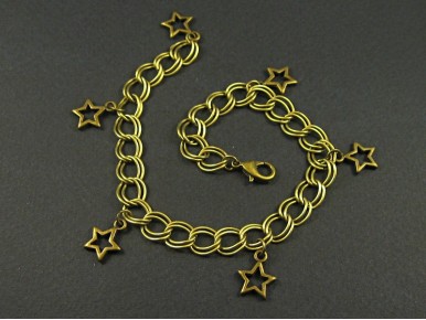 Bracelet en métal fantaisie couleur bronze avec des breloques étoiles