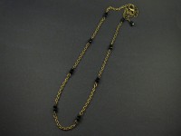 Collier fantaisie couleur bronze agrémenté de perles facettées noires